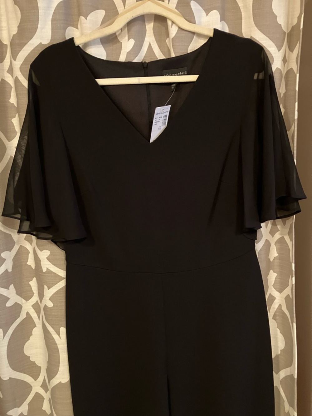 Connected V neck jumpsuit with flutter sleeves New with Tags